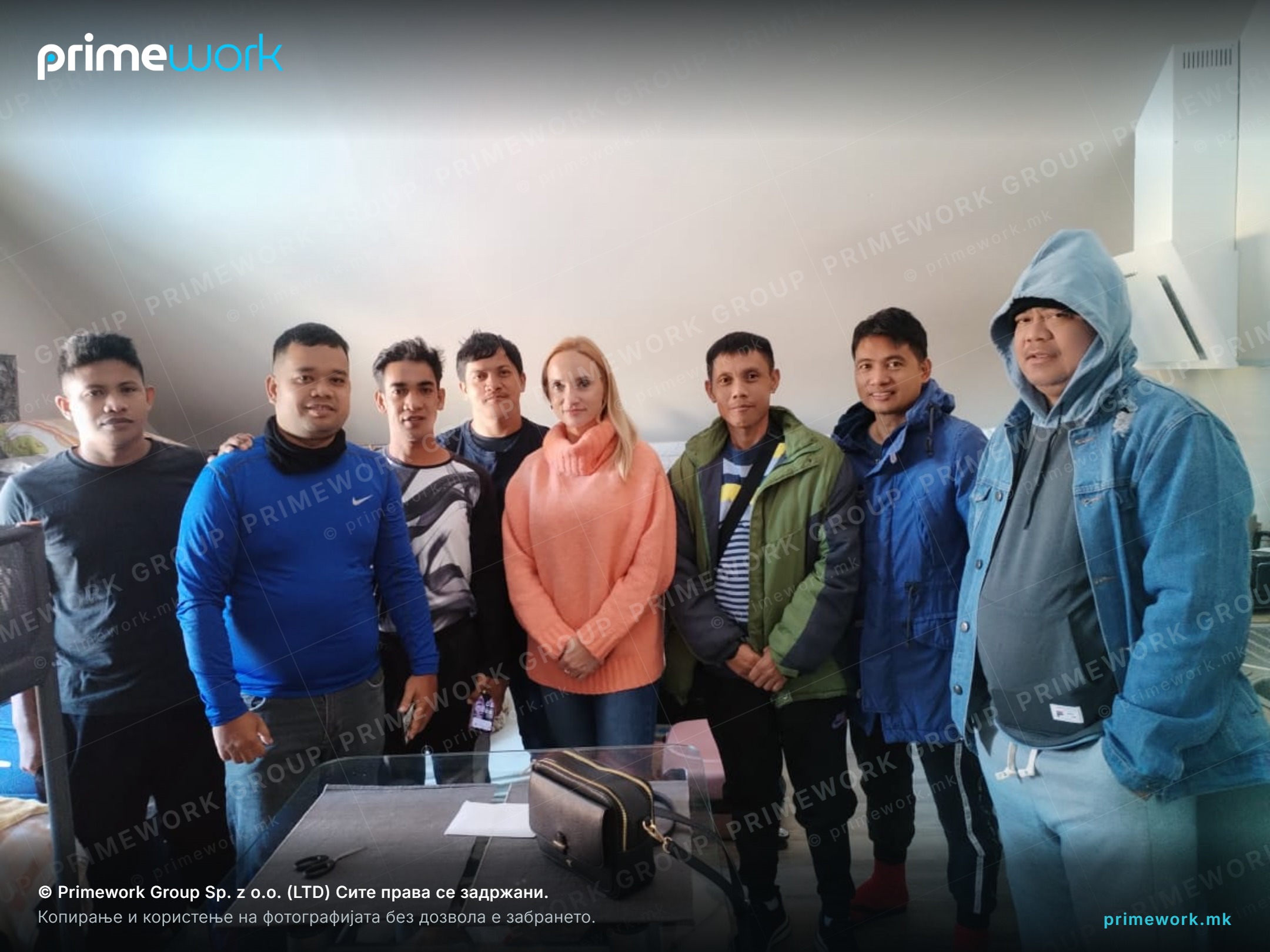 A Primework coordinator with workers during a visit to their accommodation