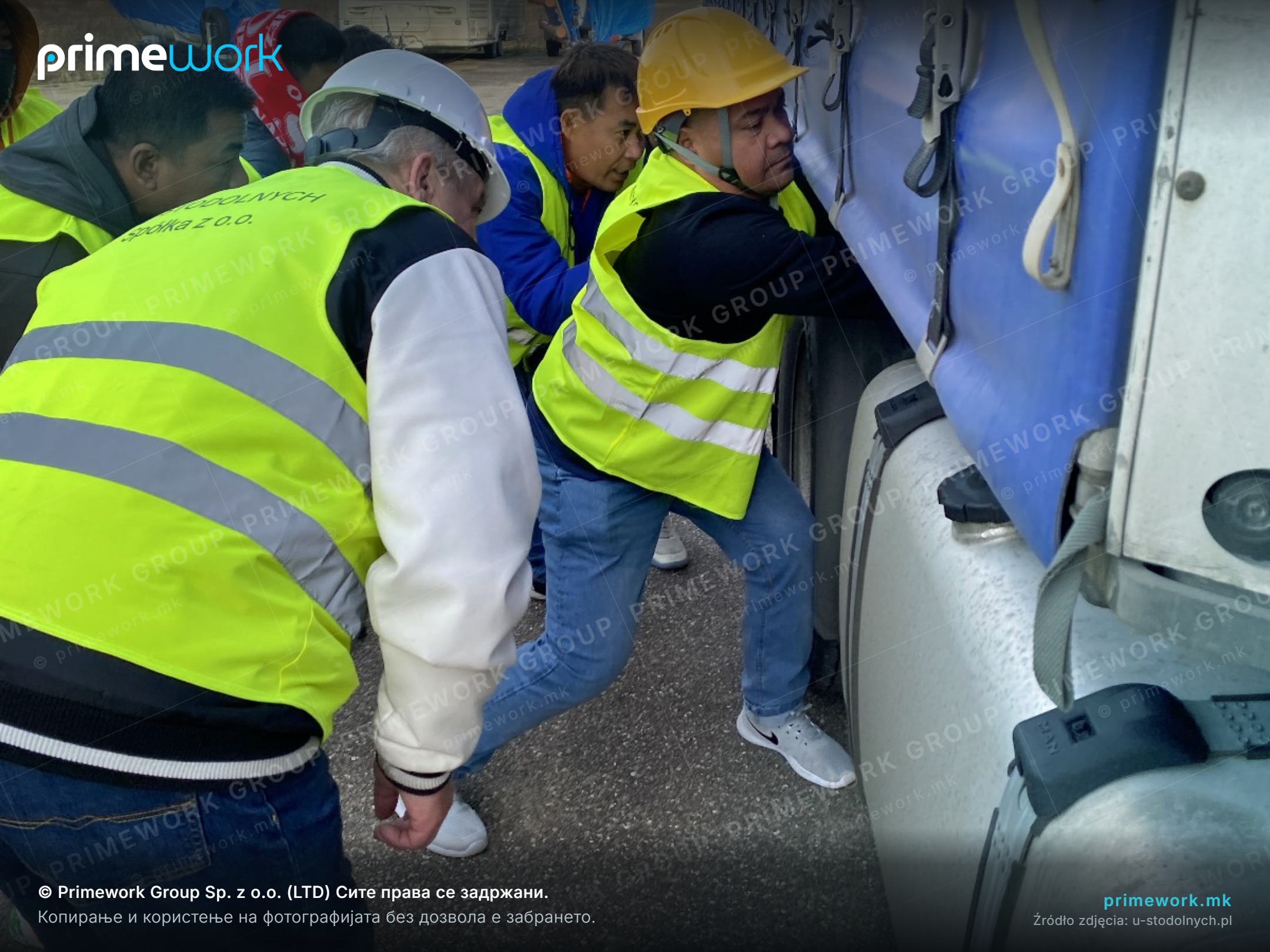 Practical training for a driver from Asia at a truck with an instructor