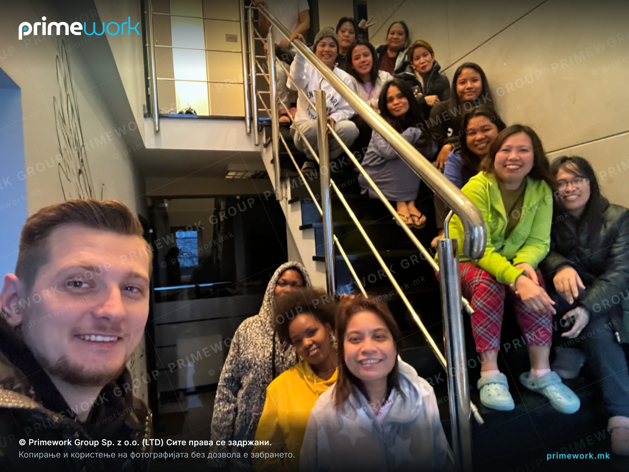 A team of Filipino candidates with a Primework recruiter in the agency office