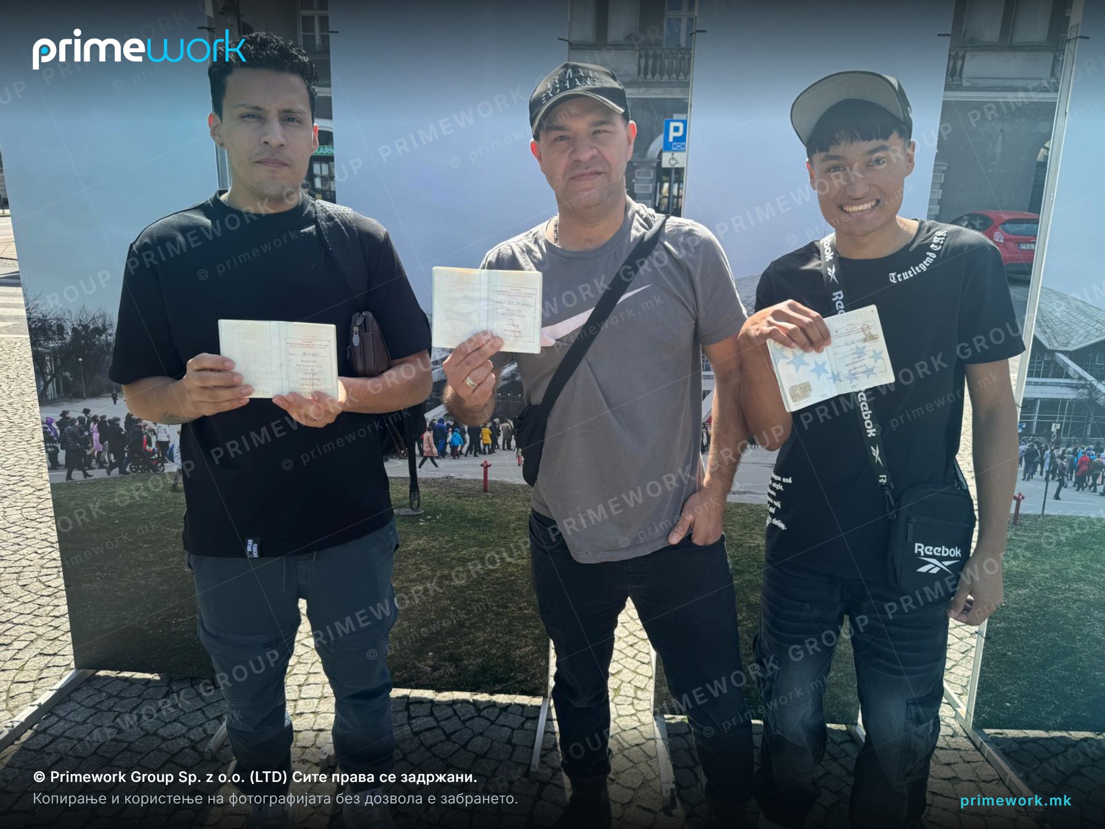 Two workers from Asia holding their residence documents