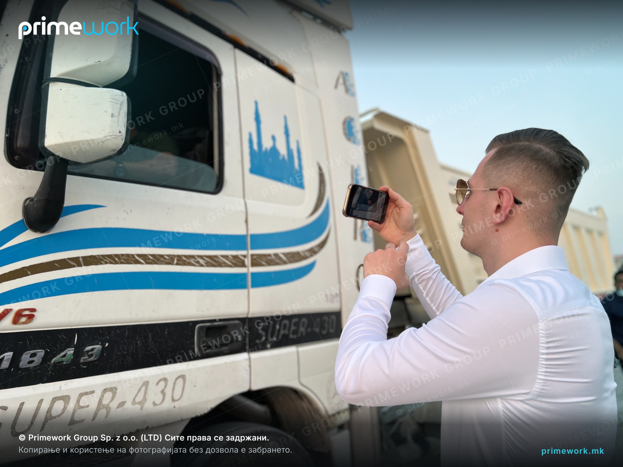 A coordinator documenting the condition of a truck at a transport base